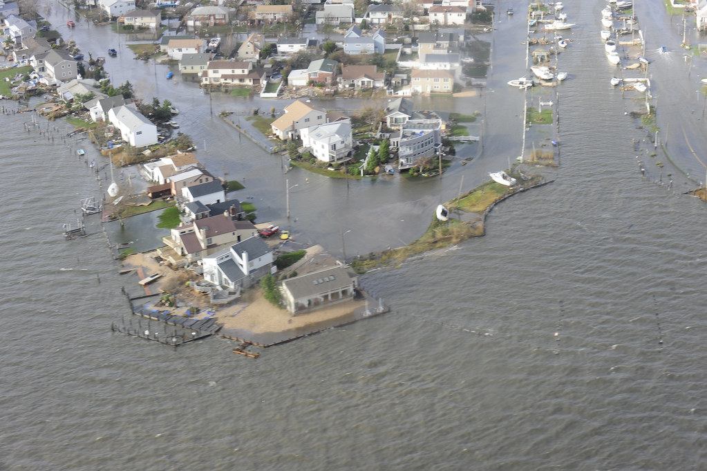 Aerial view of waterfront homes on Long Island surrounded by floodwater after Hurricane Sandy